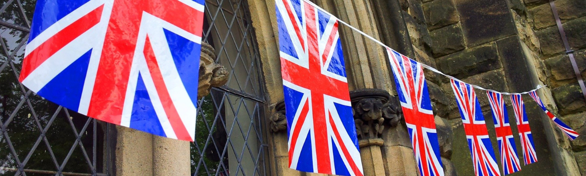 Union flag bunting hanging outside a building
