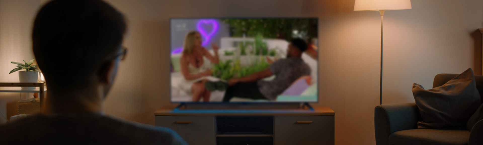 Someone watching Love Island on tv